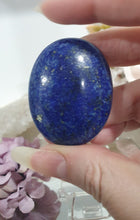 Load image into Gallery viewer, Lapis Lazuli Crystal Palm Stone palm stone on plastic stand.
INSPIRES HARMONY, WISDOM & PSYCHIC PROTECTION
Lovely Lapis Lazuli Crystal Palm stone with pyrite inclusions on plastic stand. So pretty.