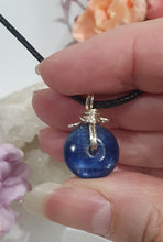Load image into Gallery viewer, Stunning Blue Kyanite crystal stone donut crystal carving wire wrapped in non tarnish silver wire. Come with a black cork necklace.
