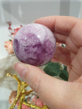 Load image into Gallery viewer, Purple Fluorite Sphere Crystal Carving Stone on Gold Branch shaped stand.