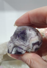 Load image into Gallery viewer, Skull Amethyst Chevron Crystal Carving Stone.
INSPIRES INTUITION & SPIRITUALITY
Beautiful polished Amethyst Chevron Skull Crystal Carving Stone.