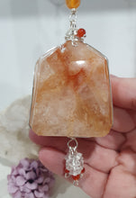 Load image into Gallery viewer, THE FIRE WITHIN" Handcrafted Fire Quartz Tower Crystal Carving Silver Crystal Energy Enhancer© Gemstone / Hanger / Suncatcher / Ornament
STRENGTH | POWER | SPIRITUALITY
Beautiful Fire Quartz Tower Carving Crystal Energy Enhancer© / Sun Catcher / Ornament / Hanger beaded with Fire Quartz, Carnelian and Quartz. wired in Silver