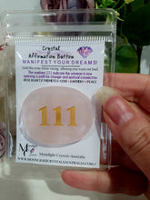 Load image into Gallery viewer, manifest your dreams and desires. Crystal rose quartz Crystal Carving affirmation button. Hold and voice what you desire. 111 indicates the universe to opening up a path for change and reaching your dreams.