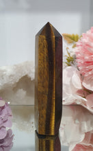 Load image into Gallery viewer, SECONDS STOCK - Tigers Eye Crystal Point Tower Stone
THIS POINT IS A LITTLE WOBBLY
INSPIRES STRENGTH AND SUCCESS
Tigers Eye Tower Crystal Stone. Discounted as this is wobbly.
