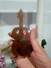 Load image into Gallery viewer, Beautiful Guitar Agate Crystal Carving Stone on Silver Stand. Promotes balance and harmony.