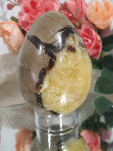 Load image into Gallery viewer, Beautiful polished Septarian Egg Crystal Carving Stone on plastic stand. A must for any crystal collector
