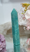 Load image into Gallery viewer, Amazonite Crystal Point Tower Stone. Shes a tad wobbly.
INSPIRES HOPE
Lovely Amazonite crystal point tower. Discounted as a little bit wobbly but still a lovely tower
