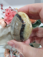 Load image into Gallery viewer, Beautiful polished Septarian Egg Crystal Carving Stone on plastic stand. A must for any crystal collector