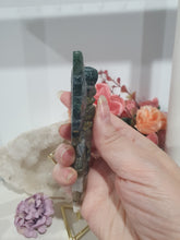 Load image into Gallery viewer, Stunning Moss Agate Dagger with Angel Wings Crystal Carving Stone on Gold Stand. Tranquility and Grounding Energy