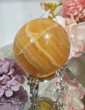 Load image into Gallery viewer, Orange Calcite Sphere Crystal Carving Stone on Silver Stand. This has a crack in it
Inspires JOY AND SELF CONFIDENCE
Lovely Orange Calcite Crystal Sphere on silver stand. Discounted as has a crack. still a gorgeous sphere.