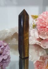 Load image into Gallery viewer, SECONDS STOCK - Tigers Eye Crystal Point Tower Stone
THIS POINT IS A LITTLE WOBBLY
INSPIRES STRENGTH AND SUCCESS
Tigers Eye Tower Crystal Stone. Discounted as this is wobbly.