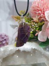 Load image into Gallery viewer, "WING OF AN ANGEL" Amethyst Angel Wing Crystal Stone Pendant wire wrapped Silver .
Inspires Divine Connection and Intuition.
Angel Wings symbolise love, protection, purity and freedom. Connections to the Angels and divine realm.
Beautiful handcrafted Amethyst Angel Wing Crystal Carving Pendant in silver non tarnish wire. Comes with a cord necklace.