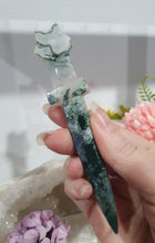 Load image into Gallery viewer, SECONDS STOCK polished Moss Agate Athame (Dagger) Crystal Carving Stone.
PROMOTES GROUNDING AND CONNECTION TO EARTH
An Athame is a ceremonial knife used in spiritual rituals to direct energy, cast circles, and represent the element of fire or air, but it is typically not used for physical cutting.
dagger / Athame Moss Agate crystal carving. discounted as has lots of imperfection.