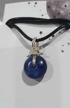 Load image into Gallery viewer, Stunning Blue Kyanite crystal stone donut crystal carving wire wrapped in non tarnish silver wire. Come with a black cork necklace.