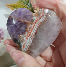 Load image into Gallery viewer, Amethyst Agate Heart Crystal Carving Stone on plastic Stand
Inspires intuition and Emotional Well Being
Beautiful Polished Amethyst Agate Heart Crystal Carving on plastic stand. Has natural formations.