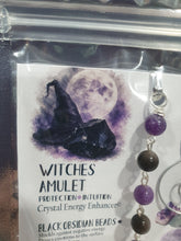 Load image into Gallery viewer, WITCHES AMULET - Handcrafted Obsidian Stone Crystal Energy Enhancer© / Hanger / Ornament / Suncatcher
INSPIRES PROTECTION AND INTUITION
Gorgeous Obsidian raw crystal stone beaded with Black Obsidian and Amethyst. Wire wrapped in silver