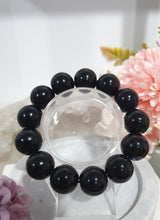 Load image into Gallery viewer, PROTECTION SHIELD" Black Obsidan Beaded Bracelet Crystal Gemstone
7 - 7.5inch with 14mm beads.
INSPIRES PROTECTION AND BALANCE
Lovely chunky Black Obsidian Gemstone Beaded Bracelet. Intuitively (Randomly) chosen.