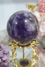Load image into Gallery viewer, Amethyst Chevron Sphere Crystal Carving Stone on Gold Stand
Inspires INTUITION AND SPIRITUALITY
Lovely Amethyst Crystal Sphere on gold stand. Gorgeous colouring.
