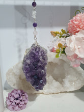 Load image into Gallery viewer, THE SEER AMULET - handcrafted Amethyst Cluster silver Crystal Energy Enhancer© Hanger Ornament Suncatcher
INTUITION / SPIRITUALITY / TRUST
Gorgeous Large Amethyst Cluster beaded with Amethyst, quartz and rose quartz. Wired in Silver