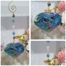 Load image into Gallery viewer, HEART OF THE OCEAN" Handcrafted Titanium Aura Sphalerite Heart Stone Crystal Carving Gold Crystal Energy Enhancer© / Hanger / Ornament / Suncatcher
Inspires PSYCHIC FLOW | LOVE | INTUITION
Gorgeous Titanium Aura Sphalerite heart crystal carving beaded with Aquamarine, Rainbow Hematite & Quartz. Wire wrapped in gold