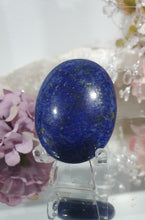 Load image into Gallery viewer, Lapis Lazuli Crystal Palm Stone palm stone on plastic stand.
INSPIRES HARMONY, WISDOM & PSYCHIC PROTECTION
Lovely Lapis Lazuli Crystal Palm stone with pyrite inclusions on plastic stand. So pretty.