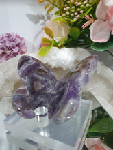 Load image into Gallery viewer, Butterfly Amethyst Crystal Carving Stone on Stand. Inspires Intuition and Spirituality.
Beautiful polished Amethyst Chevron Butterfly Crystal Carving on plastic stand