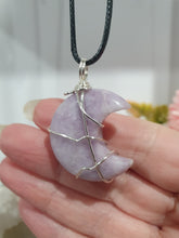 Load image into Gallery viewer, Lepidolite Moon Crystal Pendant Wire Wrapped Silver Stone with black cord chain
STONE OF TRANSITION
Beautiful Lepidolite Moon Crystal Carving Wire Wrapper in Silver non tarnish wire. Accompanied by a black cord necklace