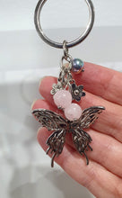 Load image into Gallery viewer, THE BUTTERFLY MESSENGER " Metal Butterfly Keyring Key chain with Rose Quartz & Rainbow Hematite Beads Stone Silver Crystal Key Ring
INSPIRES CONNECTION, LOVE & TRANSFORMATION
Carry a little Love wherever life takes you.
Lovely silver coloured metal Butterfly Keyring Key ring keychain with flower charms, beaded with Rose Quartz and Rainbow Hematite.