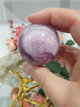 Load image into Gallery viewer, Purple Fluorite Sphere Crystal Carving Stone on Gold Branch shaped stand.