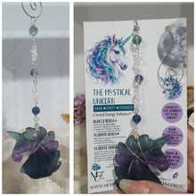 Load image into Gallery viewer, THE MYSTICAL UNICORN" Handcrafted Fluorite Unicorn Crystal Carving Silver Crystal Energy Enhancer© Gemstone / Hanger / Suncatcher / Ornament
PURITY | STRENGTH | MAGIC
Beautiful Fluorite Unicorn Carving Crystal Energy Enhancer© / Sun Catcher / Ornament / Hanger beaded with Fluorite and Quartz. wired in Silver