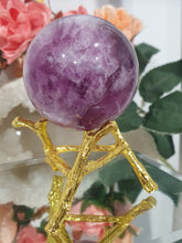 Load image into Gallery viewer, Purple Fluorite Sphere Crystal Carving Stone on Gold Branch shaped stand.