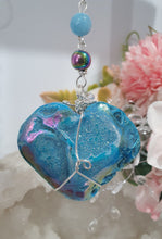 Load image into Gallery viewer, HEART OF THE OCEAN" Handcrafted Titanium Aura Sphalerite Heart Crystal Carving Silver Crystal Energy Enhancer© / Hanger / Ornament / Suncatcher
Inspires PSYCHIC FLOW | LOVE | INTUITION
Gorgeous Titanium Aura Sphalerite heart crystal carving stone beaded with Aquamarine, Rainbow Hematite & Quartz. Wire wrapped in silver