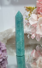 Load image into Gallery viewer, Amazonite Crystal Point Tower Stone. Shes a tad wobbly.
INSPIRES HOPE
Lovely Amazonite crystal point tower. Discounted as a little bit wobbly but still a lovely tower