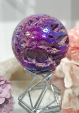 Load image into Gallery viewer, Pink Titanium Aura Sphalerite Sphere Crystal Carving on Silver Stand.
PROMOTES PSYCHIC DEVELOPMENT AND UPLIFTS
Absolutely Stunning Pink Titanium Aura Sphalerite Crystal Sphere on Silver Sand. The druzy on this in insane!.