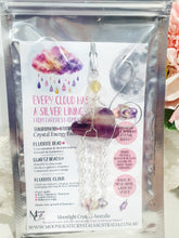 Load image into Gallery viewer, Lovely "EVERY CLOUD HAS A SILVER LINING" Fluorite Cloud silver wired Crystal Energy Enhancer© Hanger Ornament Suncatcher.
From Darkness comes Light.
TRANSFORMATION / INTUITION / SPIRITUALITY
Beautiful Fluorite Cloud Crystal Carving beaded with Fluorite & Quartz. wired in Silver