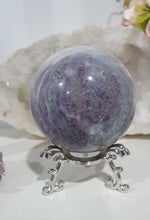Load image into Gallery viewer, Beautiful Fluorite Sphere Crystal Carving on Silver Stand. Inspires Stability, Grounding and Concentration. Lovely patterns and colouring with inclusions.