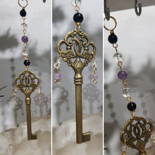 Load image into Gallery viewer, "MAGICKAL KEY OF PROTECTION" Brass Key with Amethyst Crystal Energy Enhancer© / Hanger / Ornament / Suncatcher 200mm | Inspires Protection & Wisdom
