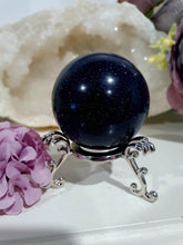 Load image into Gallery viewer, Sparkly Blue Sandstone Sphere Crystal Carving on Silver Stand. Inspires Concentration and Courage. Gorgeous