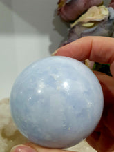 Load image into Gallery viewer, Celestite Sphere Crystal Carving on Silver Stand. Inspires Communication with the Angels