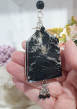 Load image into Gallery viewer, LIGHT THROUGH DARKNESS" Handcrafted Black Agate Tower Crystal Carving Silver Crystal Energy Enhancer© Gemstone / Hanger / Suncatcher / Ornament
STRENGTH | COURAGE | CLARITY
Beautiful Black Agate Tower Carving Crystal Energy Enhancer© / Sun Catcher / Ornament / Hanger beaded with Black Agate, Quartz and Herkimer Diamonds. wired in Silver