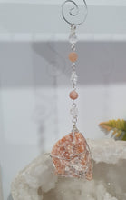 Load image into Gallery viewer, EMPOWERED BY THE SUN" Handcrafted Sunstone Raw Crystal Carving Silver Crystal Energy Enhancer© Hanger Ornament Suncatcher
Inspires EMPOWERMENT | JOY | COURAGE
Lovely Sunstone rough crystal stone beaded with Sunstone and Quartz. Wire wrapped in silver