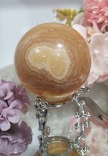 Load image into Gallery viewer, Orange Calcite Sphere Crystal Carving Stone on Silver Stand. This has a crack in it
Inspires JOY AND SELF CONFIDENCE
Lovely Orange Calcite Crystal Sphere on silver stand. Discounted as has a crack. still a gorgeous sphere.