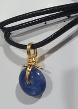 Load image into Gallery viewer, Stunning Blue Kyanite crystal stone donut crystal carving wire wrapped in non tarnish gold wire. Come with a black cork necklace.