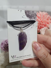Load image into Gallery viewer, "WING OF AN ANGEL" Amethyst Angel Wing Crystal Stone Pendant wire wrapped Silver .
Inspires Divine Connection and Intuition.
Angel Wings symbolise love, protection, purity and freedom. Connections to the Angels and divine realm.
Beautiful handcrafted Amethyst Angel Wing Crystal Carving Pendant in silver non tarnish wire. Comes with a cord necklace.