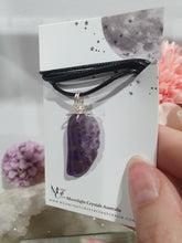 Load image into Gallery viewer, "WING OF AN ANGEL" Amethyst Angel Wing Crystal Stone Pendant wire wrapped Silver .
Inspires Divine Connection and Intuition.
Angel Wings symbolise love, protection, purity and freedom. Connections to the Angels and divine realm.
Beautiful handcrafted Amethyst Angel Wing Crystal Carving Pendant in silver non tarnish wire. Comes with a cord necklace.