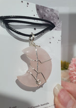 Load image into Gallery viewer, Rose Quartz Moon Crystal Pendant Wire Wrapped Silver Stone with black cord chain
INSPIRES UNCONDITIONAL LOVE & HARMONY
Beautiful Rose Quartz Moon Crystal Carving Wire Wrapper in Silver non tarnish wire. Accompanied by a black cord necklace