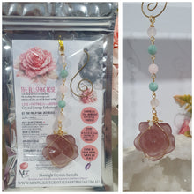 Load image into Gallery viewer, "THE BLUSHING ROSE" Strawberry Quartz Rose Carving gold Crystal Energy Enhancer© Hanger Ornament Suncatcher.
HAPPINESS / LOVE / HARMONY
"THE BLUSHING ROSE - Like the petals of a rose unfolding, The Blushing Rose encourages us to embrace self-love, joy and the beauty within."
Gorgeous Strawberry Quartz Rose Crystal Carving beaded with Ice Pink Malaysian Jade, Rose Quartz, Amazonite and Quartz. Wire wrapped in gold