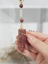 Load image into Gallery viewer, COMPASSION / SELF WORTH / SPIRITUAL GROWTH Rhodonite Crystal Point gold Energy Enhancer / Sun Catcher / Hanger 170mm 2
