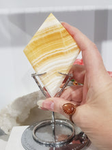 Load image into Gallery viewer, Diamond Orange Calcite Crystal Carving on Silver Stand Stone 165mm 4 BEAUTIFUL BANDING
