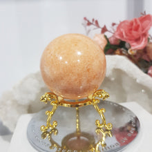 Load image into Gallery viewer, Sunstone Sphere Crystal Carving on Gold Stand Stone 50mm 1
