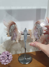 Load image into Gallery viewer, Amethyst Agate Angel Wings on stand.

Inspires Intuition and connection to the divine

Angel Wings
Symbolise love, protection, purity and freedom. Connections to the Angels and divine realm.

Beautiful Amethyst Agate Angel wings on stand.   A must for any crystal collection!
